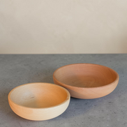 Ecohub NZ Entertainers Beech Nesting Bowl Set of 2 - natural beech wood - empty sitting side-by-side on a textured grey concrete surface
