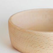 Ecohub NZ Entertainers Beech Handled Snack Bowl (15cm) - natural beech wood - close-up of the bowl's edge showing wood grain on white