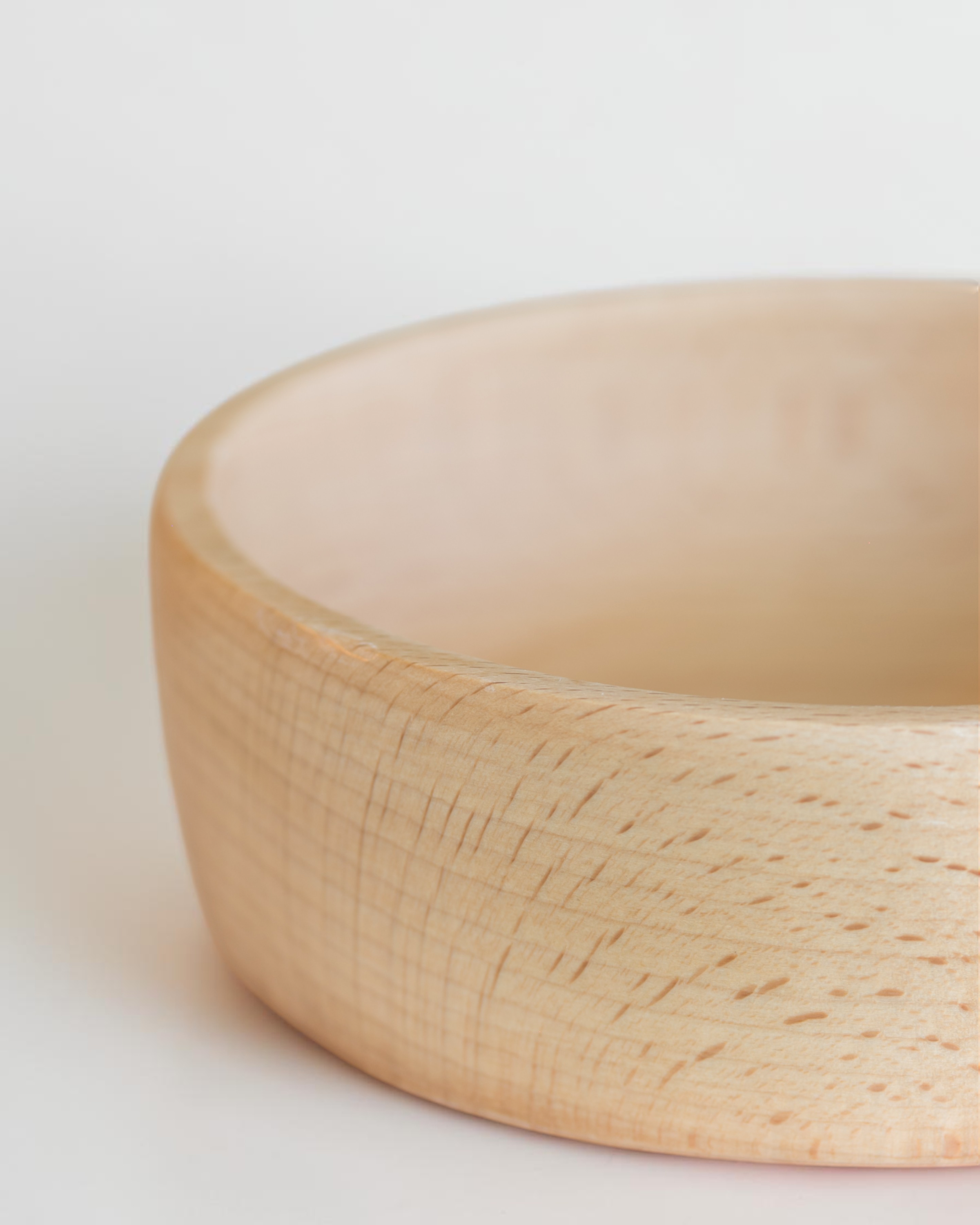 Ecohub NZ Entertainers Beech Handled Snack Bowl (15cm) - natural beech wood - close-up of the bowl's edge showing wood grain on white