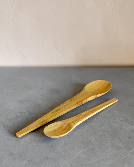 Ecohub NZ Essentials Bamboo Mixing & Serving Spoons Set of 2 - natural sustainable bamboo - close-up on textured grey concrete surface