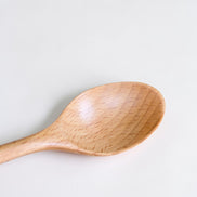 Ecohub NZ Entertainers Beech Cutlery Set of 2 - natural beech wood - close-up of the spoon bowl on a white background