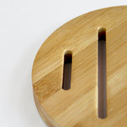 Ecohub NZ Essentials Bamboo Trivet (18cm) - natural bamboo - close-up detail showing slots and wood grain on white