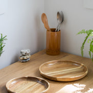 Ecohub NZ Entertainers Acacia Nesting Plate Set of 2 - natural acacia wood - separated on a sunlit wooden kitchen counter