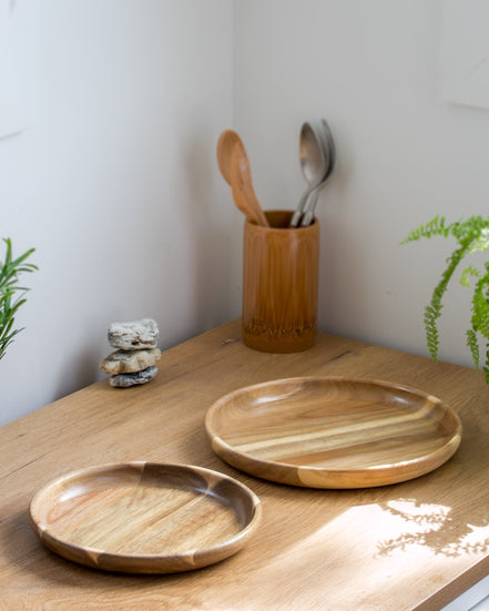 Ecohub NZ Entertainers Acacia Nesting Plate Set of 2 - natural acacia wood - separated on a sunlit wooden kitchen counter
