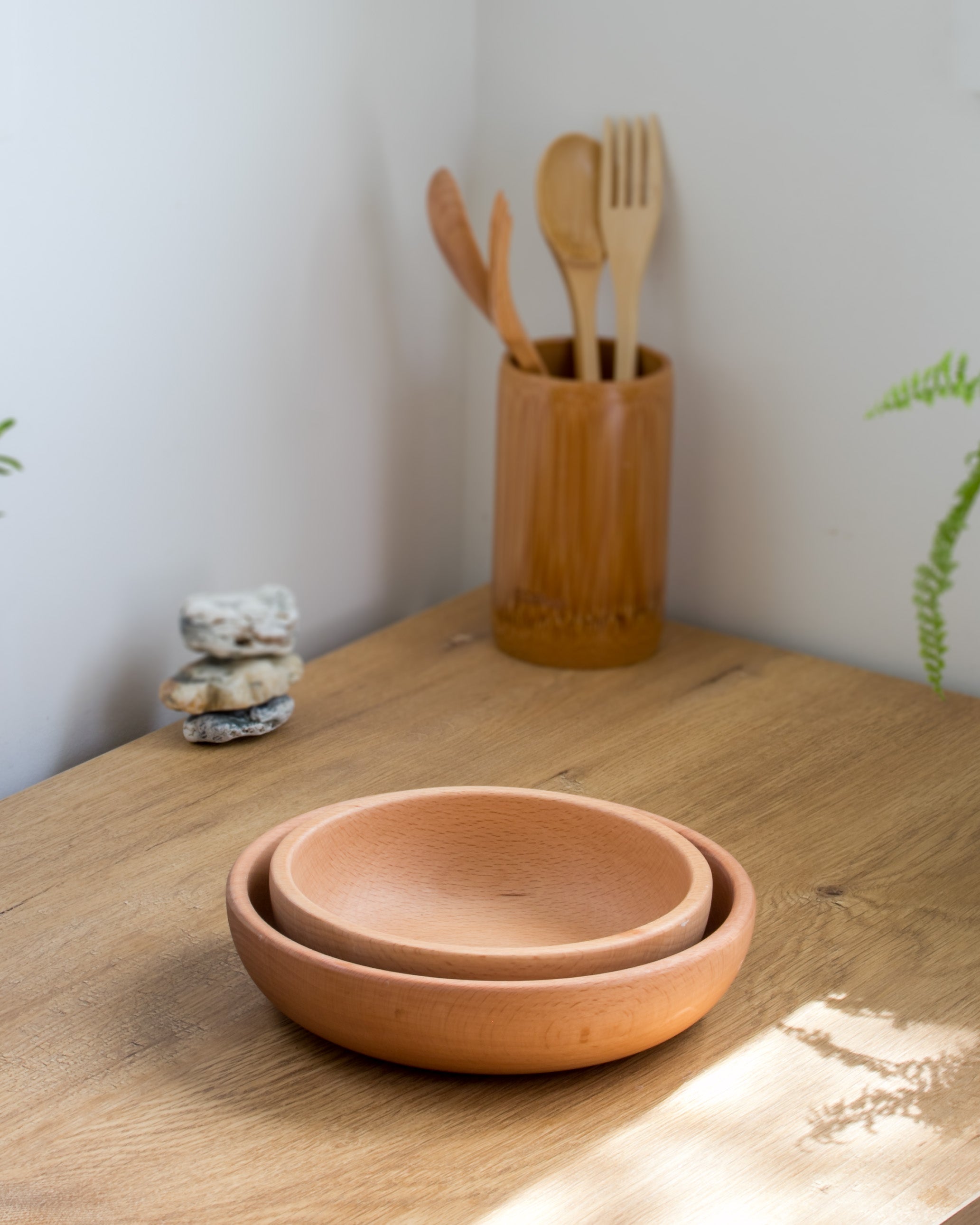 Ecohub NZ Entertainers Beech Nesting Bowl Set of 2 - natural beech wood - nested together on a wooden kitchen counter
