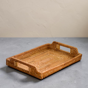 Ecohub NZ Artisans Rattan Rectangular Serving Tray (34cm) - natural rattan - empty on a grey concrete surface