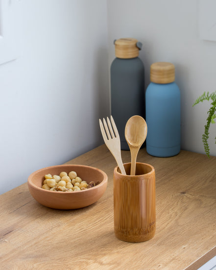 Ecohub NZ Essentials Bamboo Cutlery Set of 2 - natural bamboo - standing in a bamboo cup on a wooden kitchen counter