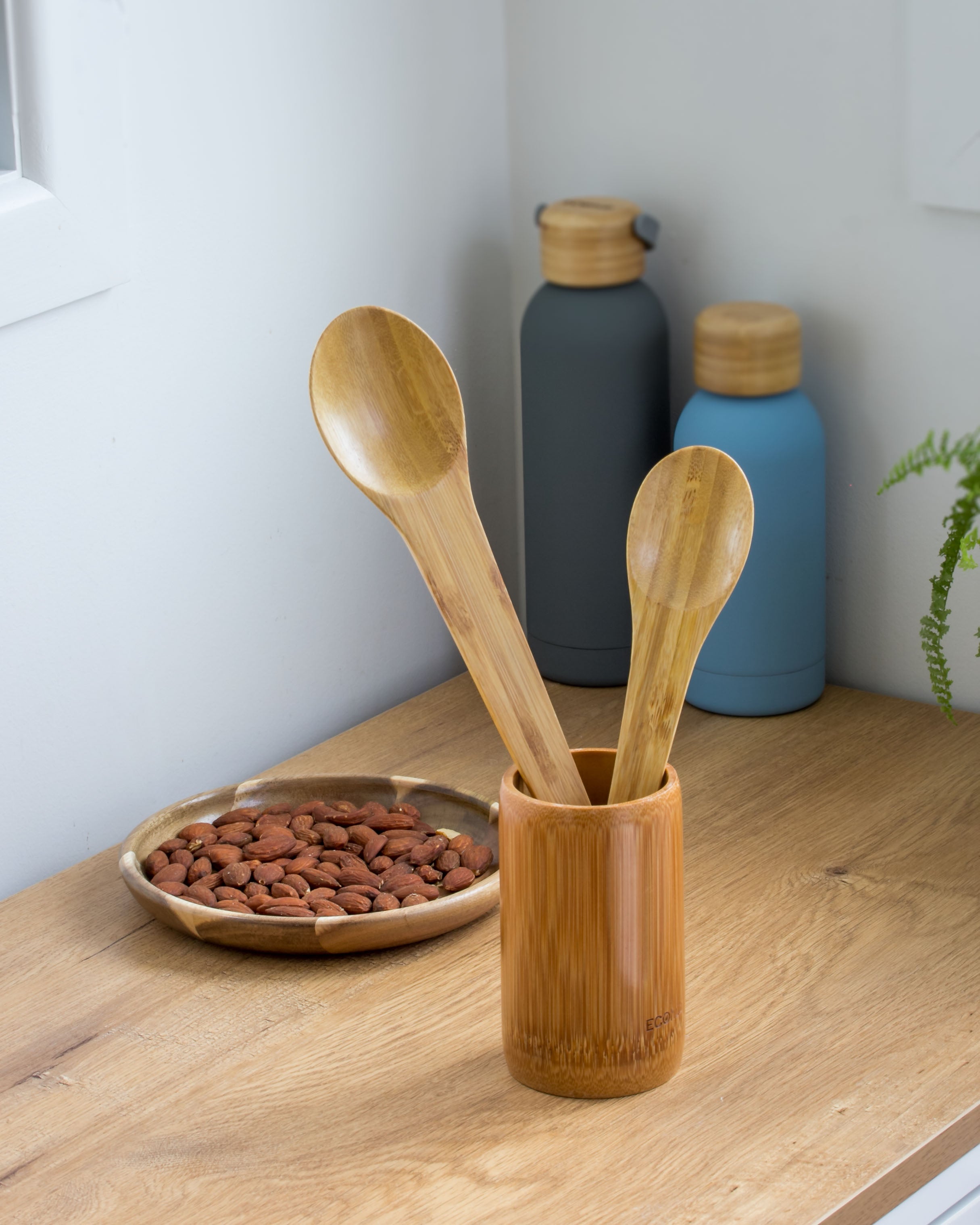 Ecohub NZ Essentials Bamboo Mixing & Serving Spoons Set of 2 - natural sustainable bamboo - functional kitchen use with bottles and a food bowl
