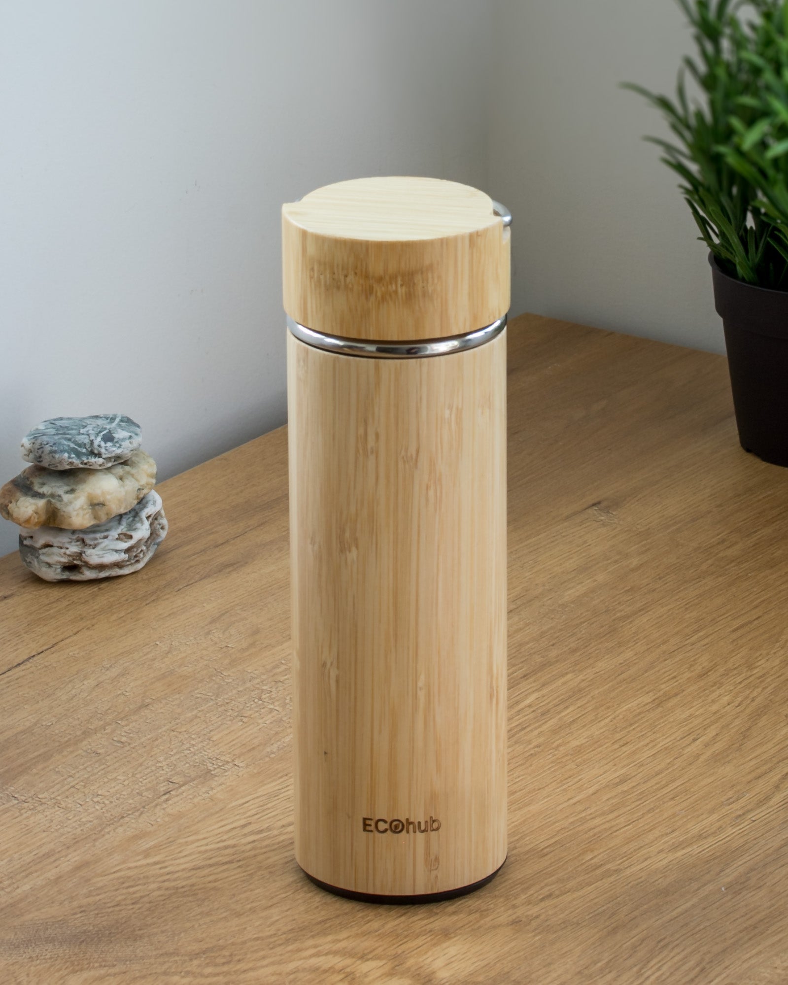 Ecohub NZ Essentials Bamboo Insulated Water Bottle (500ml) - natural bamboo and steel - standing on a wooden desk with plant