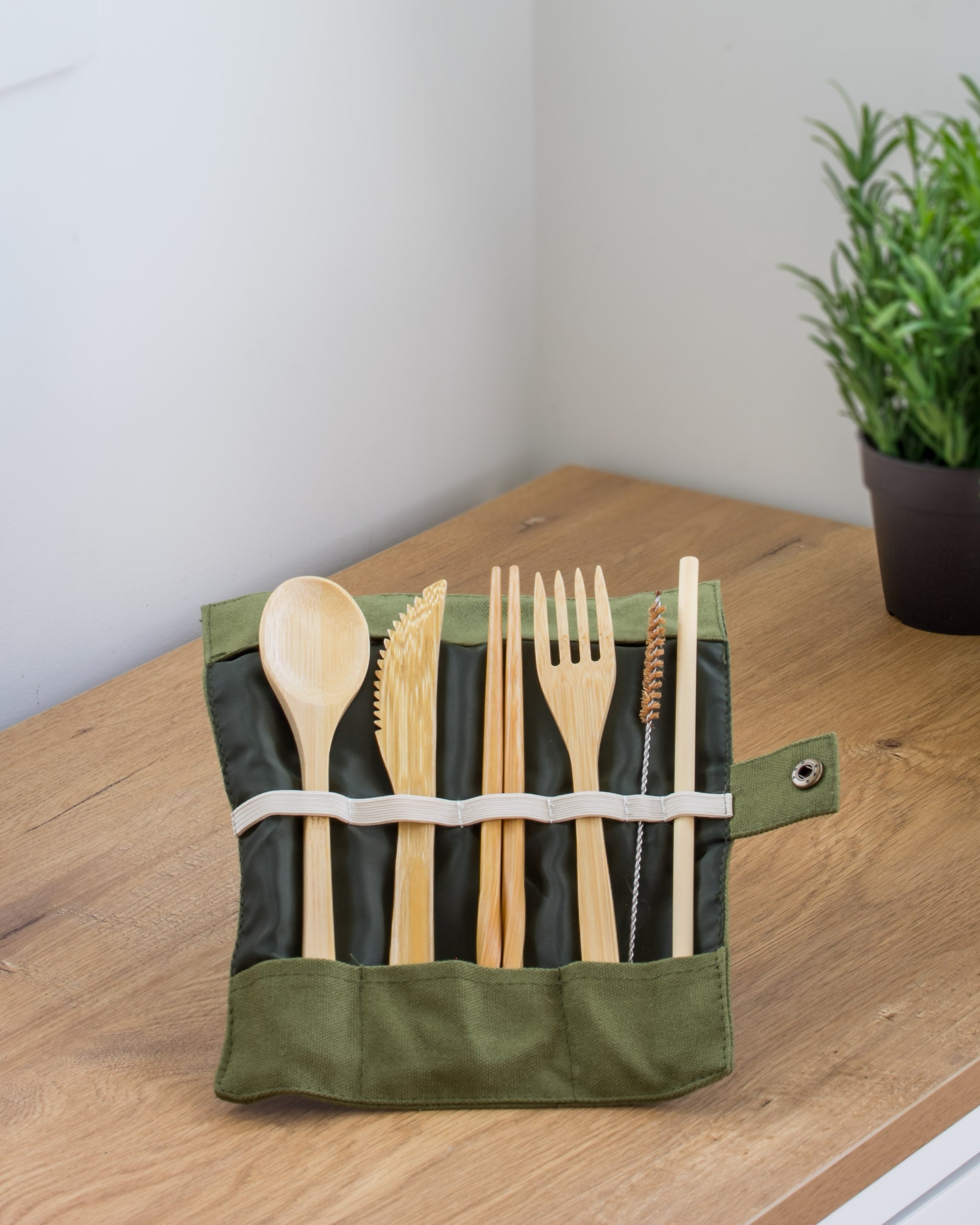 Ecohub NZ Essentials Bamboo Travel Cutlery Set of 7 - natural bamboo - unrolled standing in pouch on a wood counter
