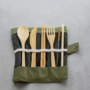 Ecohub NZ Essentials Bamboo Travel Cutlery Set of 7 - natural bamboo - unrolled in a green pouch on grey concrete
