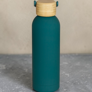Ecohub NZ Palette Insulated Water Bottle (500ml) Ocean Teal - matte and bamboo - standing on a grey concrete surface
