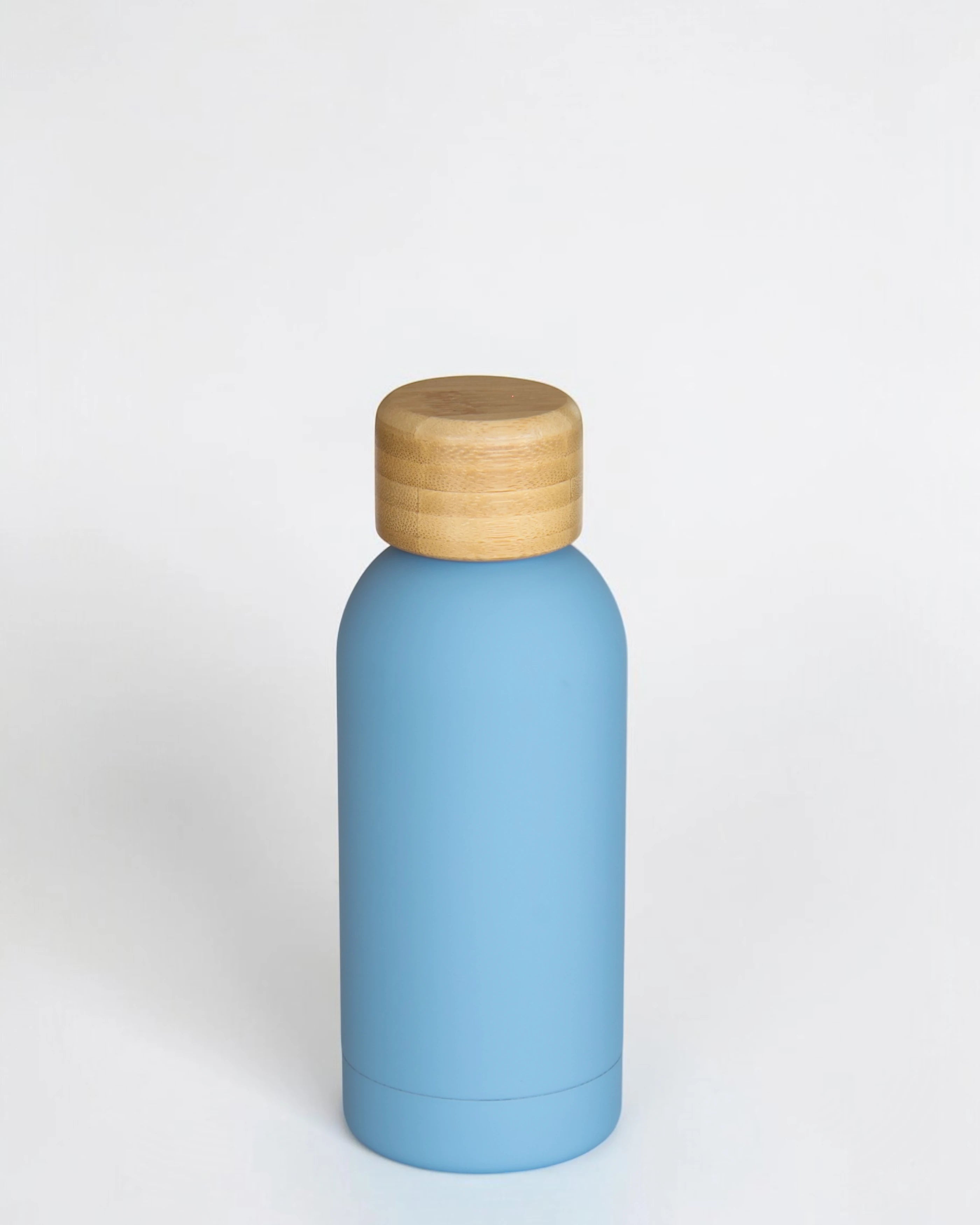 Ecohub NZ Palette Mini Insulated Water Bottle (350ml) Sky Blue - matte and bamboo - standing on a plain white background