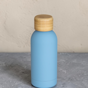 Ecohub NZ Palette Mini Insulated Water Bottle (350ml) Sky Blue - matte and bamboo - standing on a grey concrete surface
