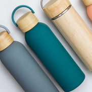Ecohub NZ Palette Insulated Water Bottle (500ml) Ocean Teal - matte and bamboo - lying flat with other bottles on white