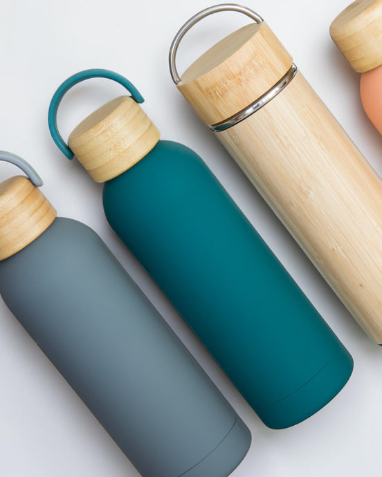 Ecohub NZ Palette Insulated Water Bottle (500ml) Ocean Teal - matte and bamboo - lying flat with other bottles on white