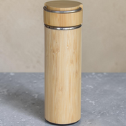 Ecohub NZ Essentials Bamboo Insulated Water Bottle (500ml) - natural bamboo and steel - standing on a grey concrete surface