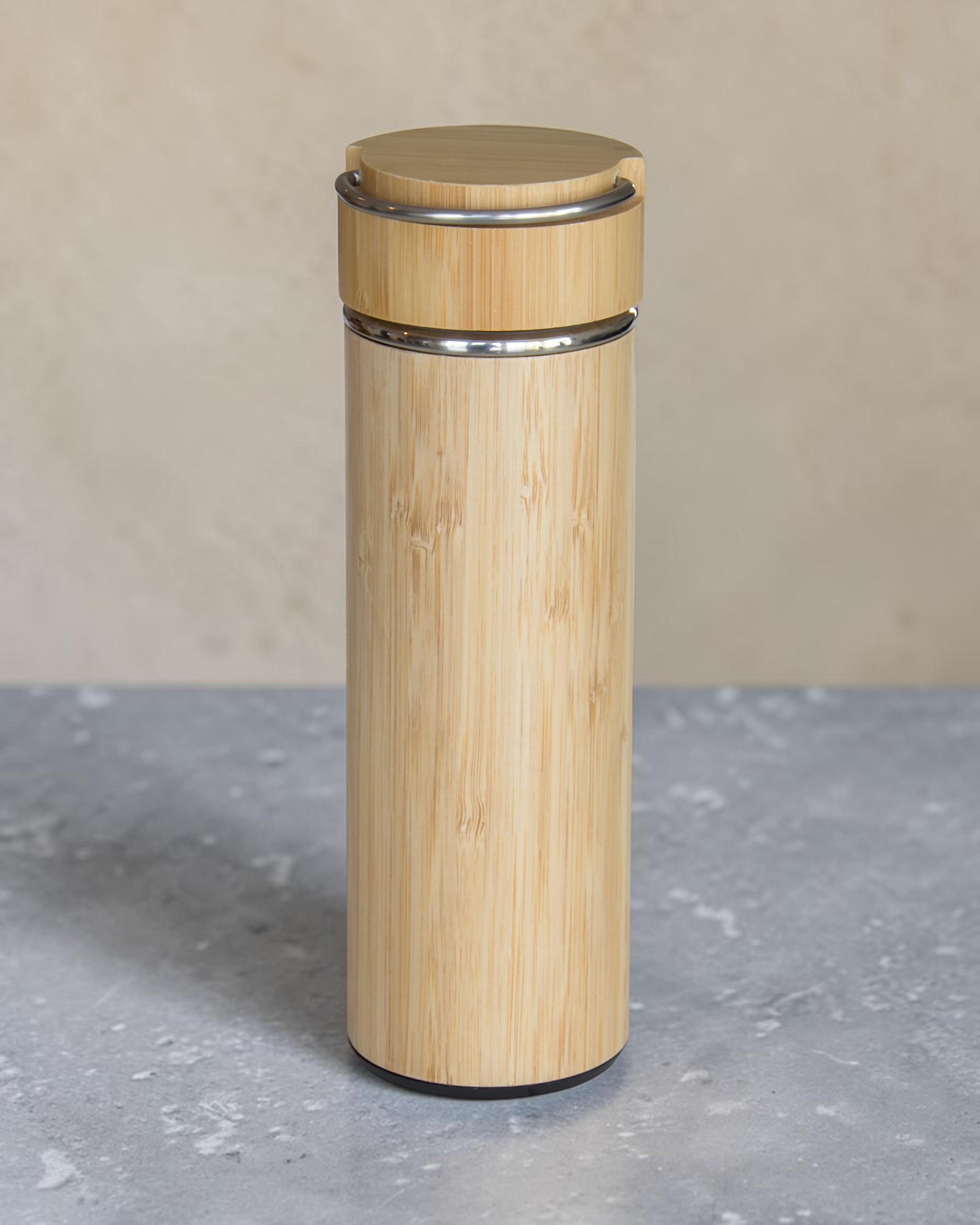 Ecohub NZ Essentials Bamboo Insulated Water Bottle (500ml) - natural bamboo and steel - standing on a grey concrete surface