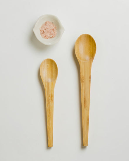 Ecohub NZ Essentials Bamboo Mixing & Serving Spoons Set of 2 - natural sustainable bamboo - flat lay with a white shell bowl containing seeds