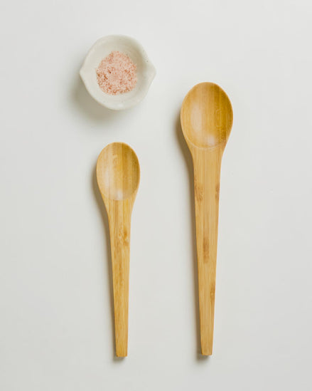 Ecohub NZ Essentials Bamboo Mixing & Serving Spoons Set of 2 - natural sustainable bamboo - flat lay with a white shell bowl containing seeds