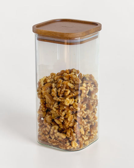 Ecohub NZ Essentials Square Acacia & Glass Pantry Jar (1.6L) - glass and acacia - filled with walnuts on a white surface